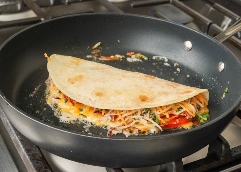 folded quesadilla in skillet