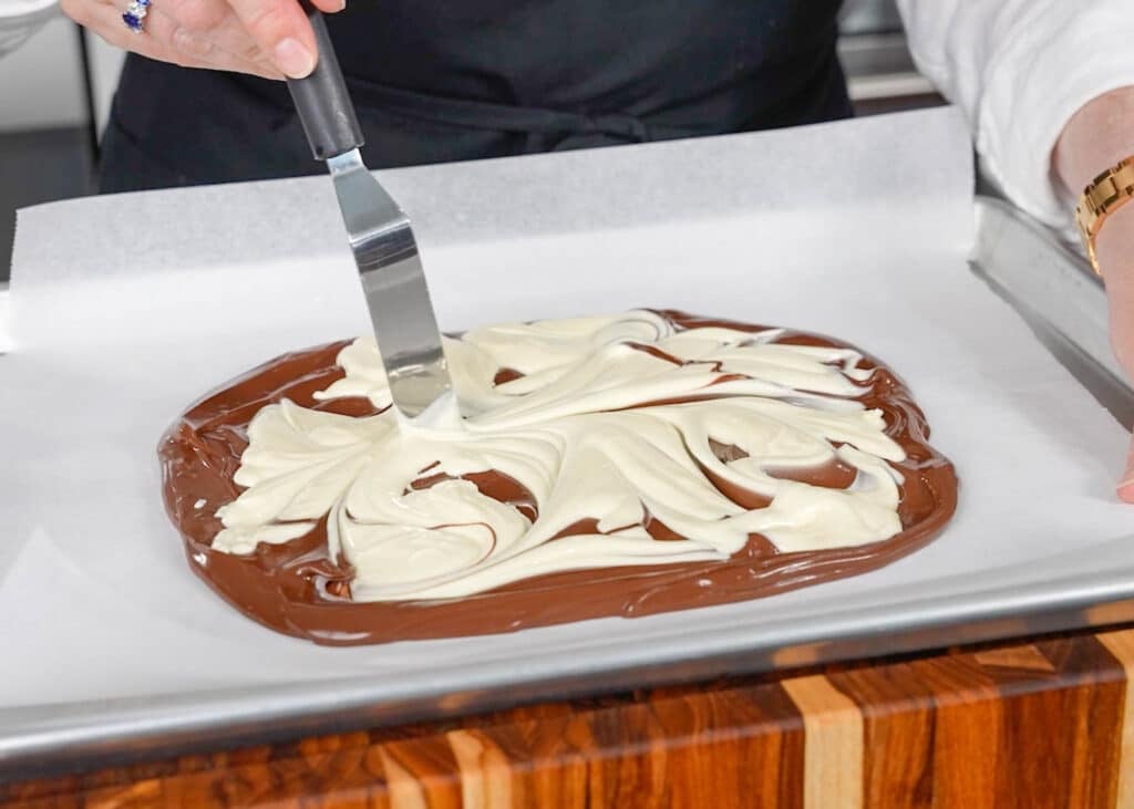 swirling dark and white chocolate together