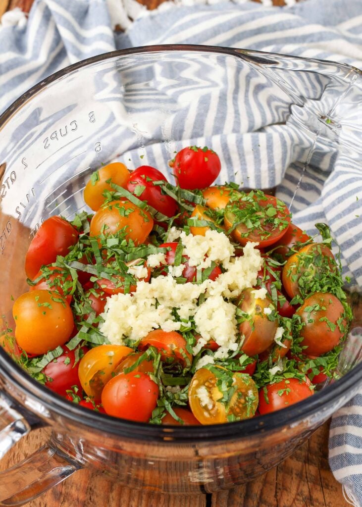 garlic over tomatoes in bowl