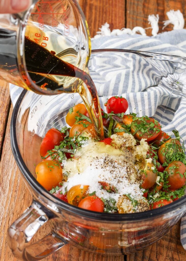 tomatoes, garlic, herbs in bowl