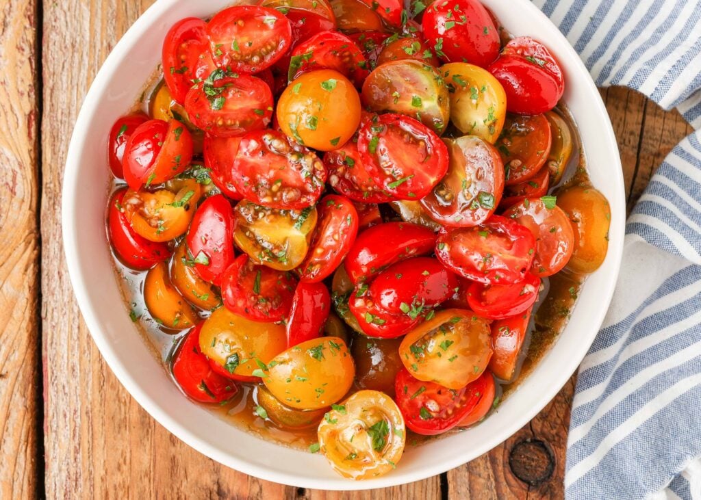 tomatoes with marinade in white bowl