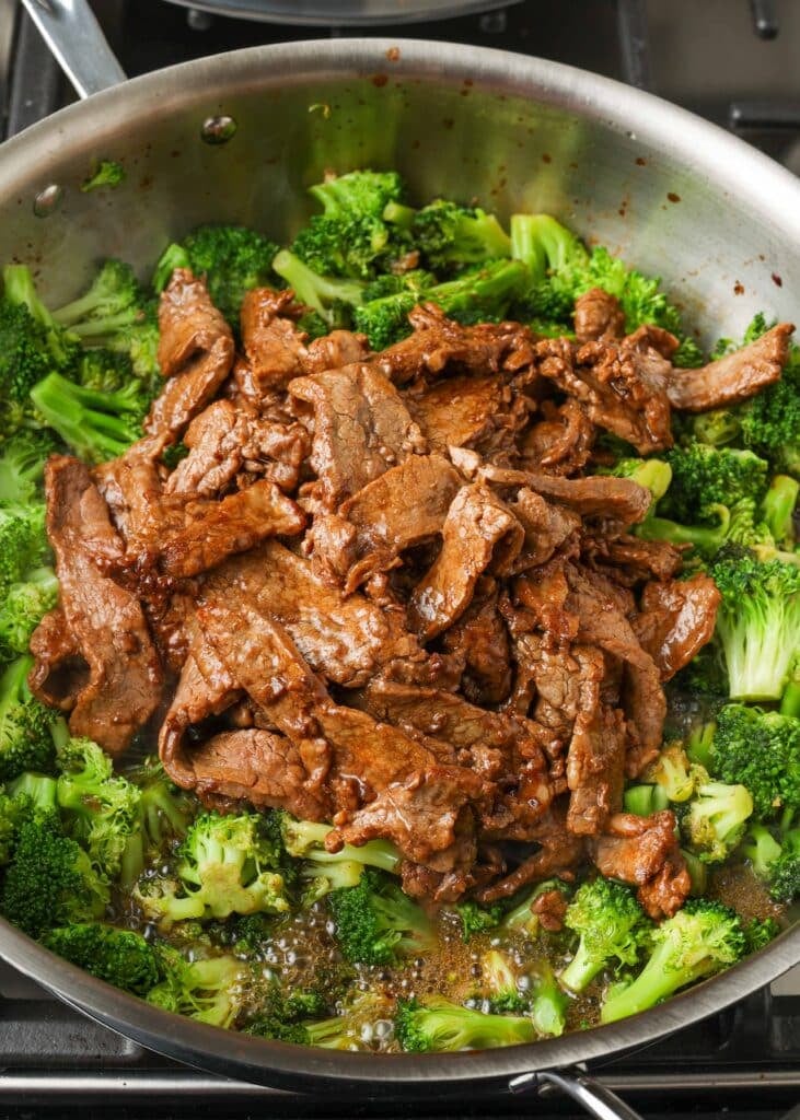 stir fried beef and broccoli in skillet